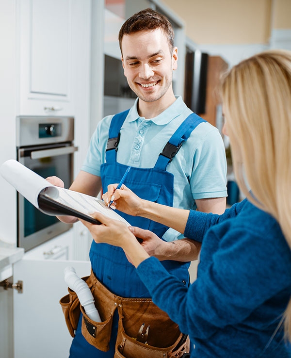 worker speaking to customer regarding paperwork